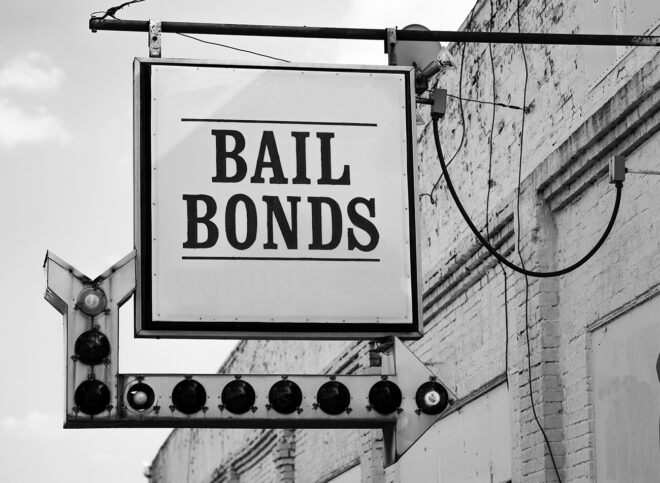 Vintage Sign in Front of Small Town Bail Bonds Office