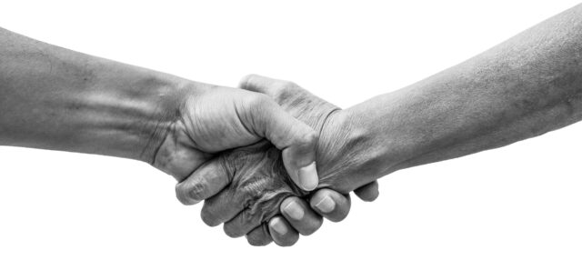 Helping hands holding together