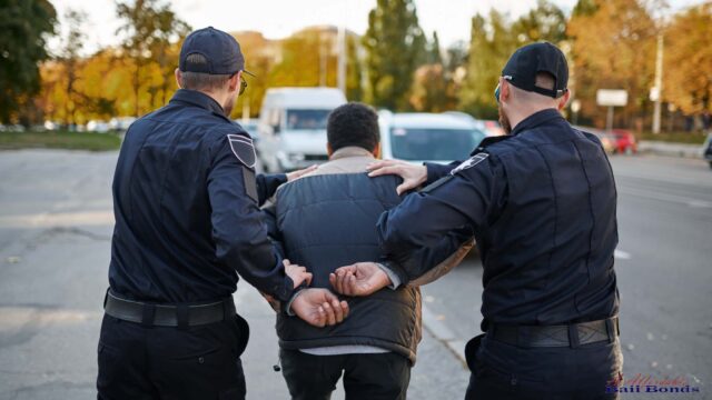 Man being detained by police officers