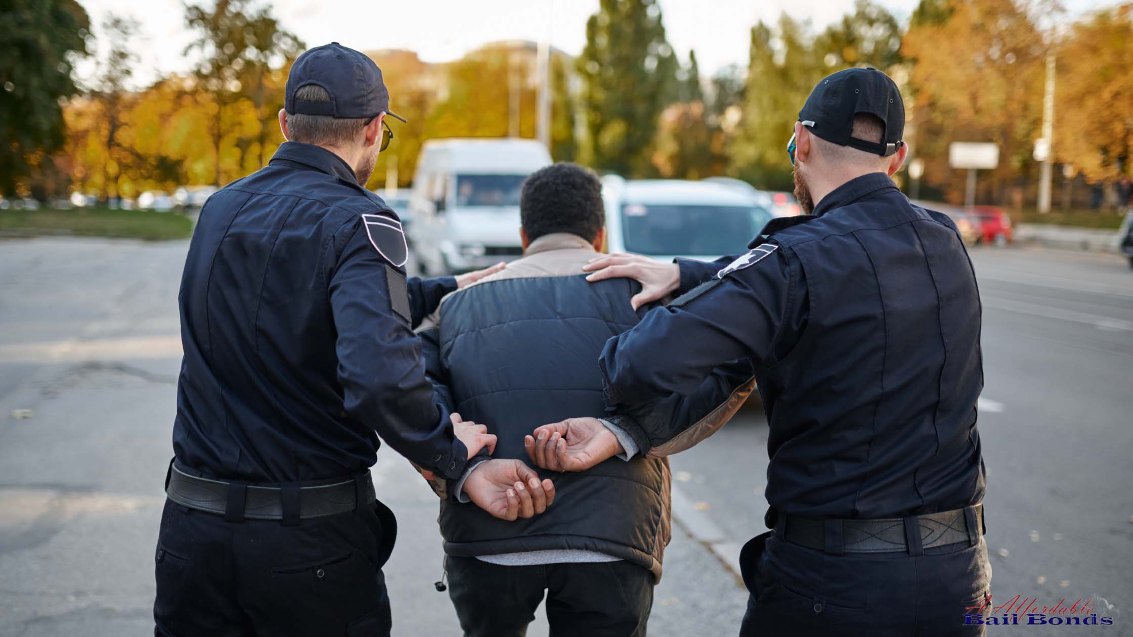 Man being detained by police officers